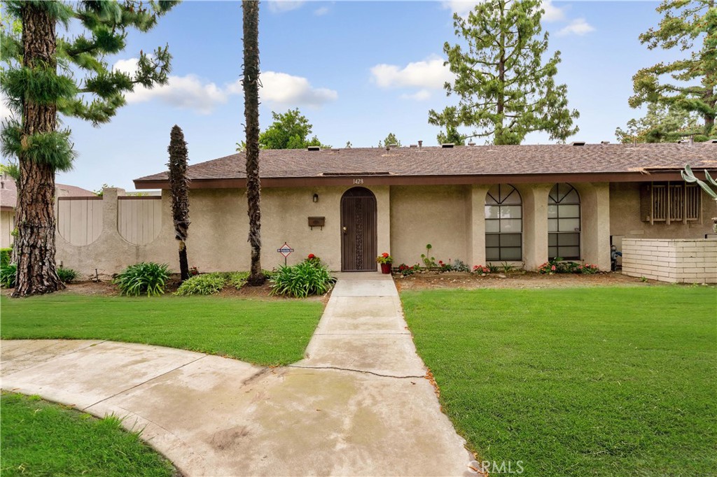 1428 Fredricks Lane Upland, CA 91786 - Photo 24 of 29 a front view of a house with a garden and yard