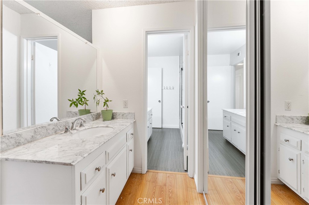 1428 Fredricks Lane Upland, CA 91786 - Photo 8 of 29 a spacious bathroom with a granite countertop sink and a mirror
