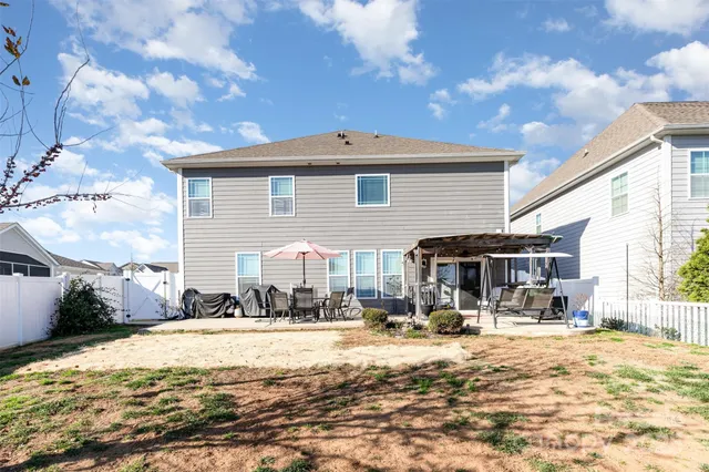 an aerial view of a balcony with chairs