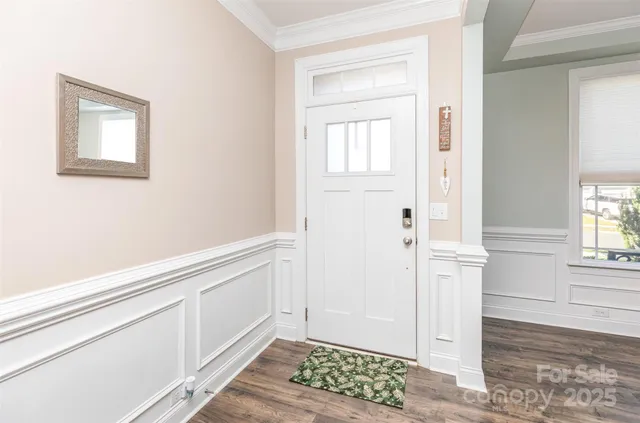 a view of entryway with wooden floor