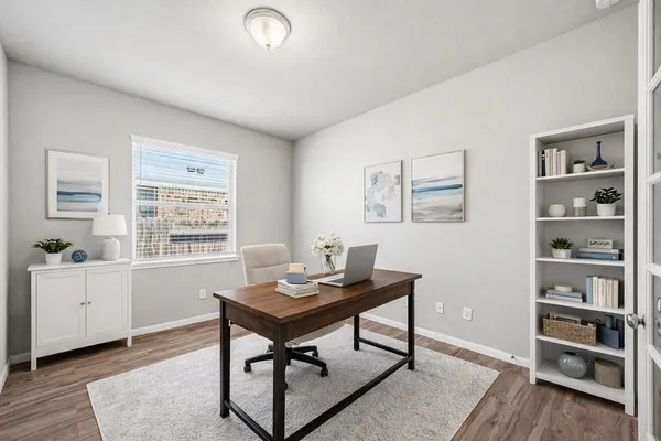 a workspace with furniture and window