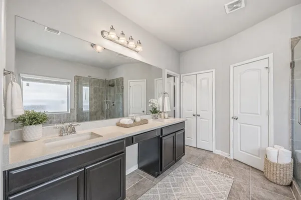 a view of a bathroom with a sink and mirror