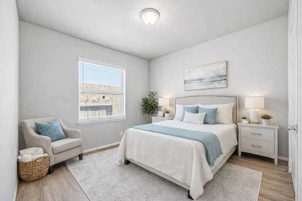 a bedroom with a bed and window