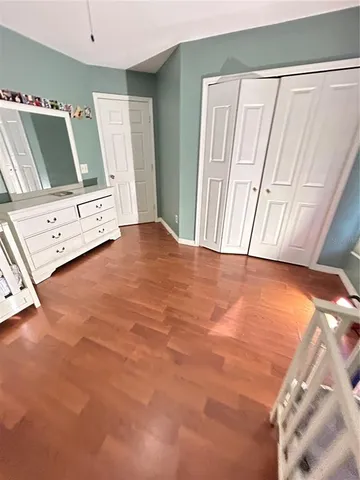 a view of a livingroom with furniture and wooden floor