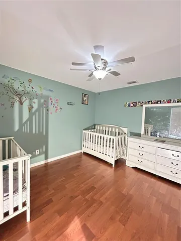 a bedroom with a bed and cabinets