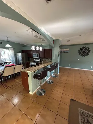 a kitchen with a sink a counter top space and appliances