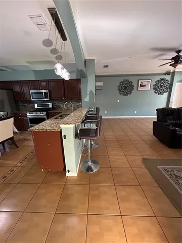 a dinning table and chairs in a kitchen