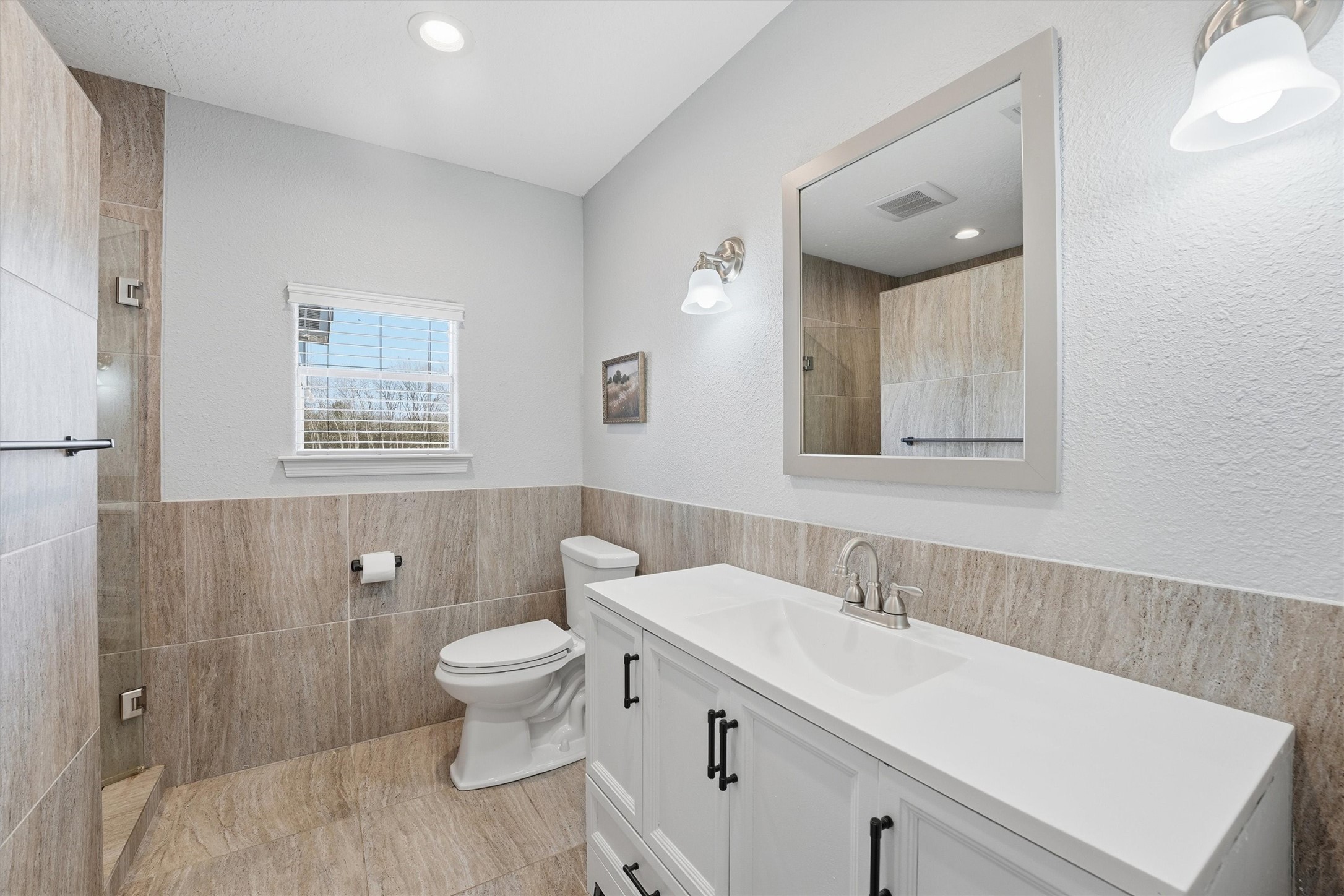 611 Reidland Road Crosby, TX 77532 - Photo 18 of 33 a bathroom with a sink a toilet and shower