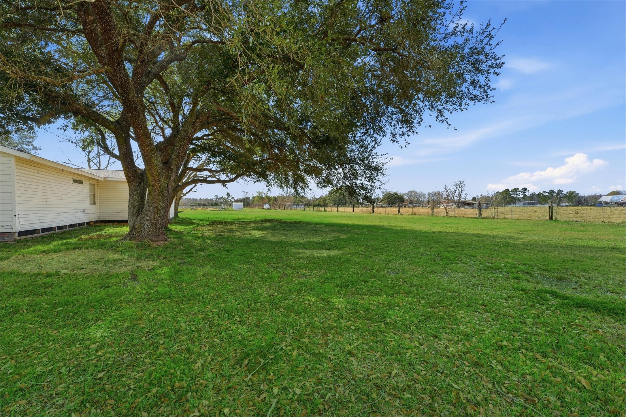 611 Reidland Road Crosby, TX 77532 - Photo 22 of 33 a view of grassy field with trees