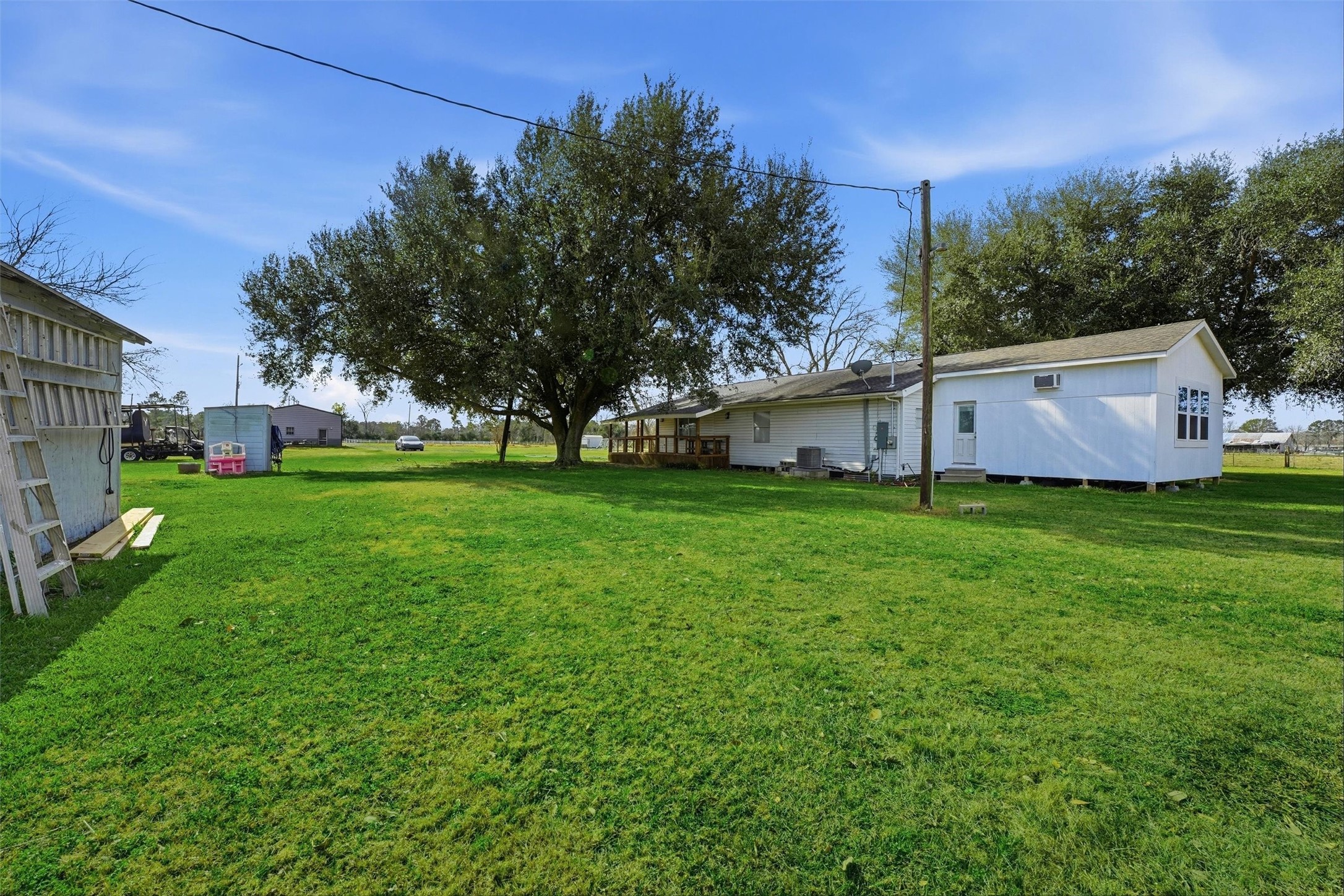 611 Reidland Road Crosby, TX 77532 - Photo 24 of 33 a view of a backyard with large trees
