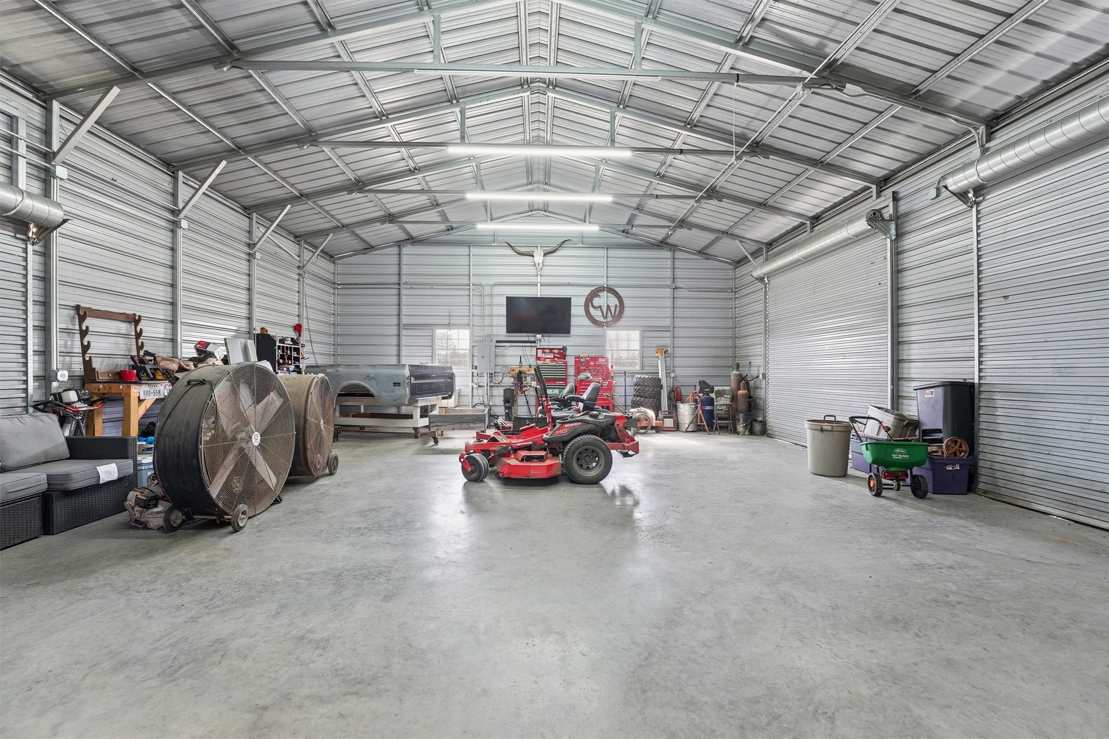 611 Reidland Road Crosby, TX 77532 - Photo 27 of 33 a view of a garage with parked cars
