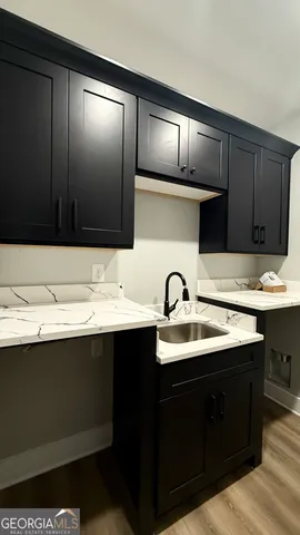 a kitchen with a sink and cabinets