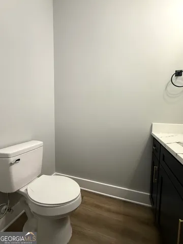 a bathroom with a toilet and a sink