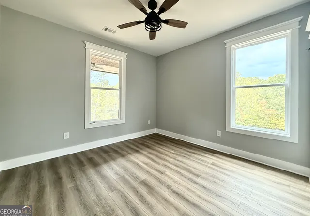 a view of an empty room with a window
