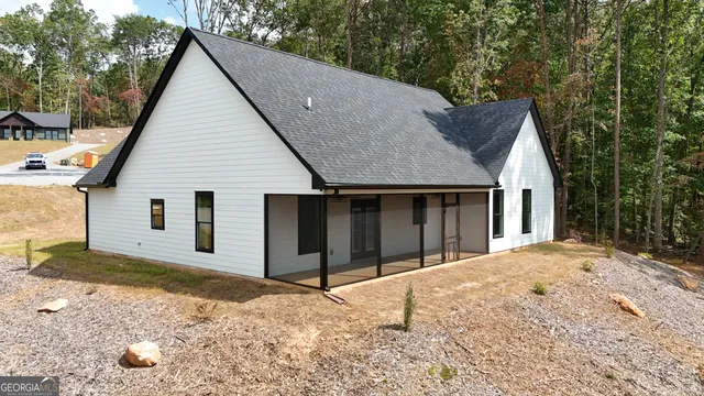 a view of a house with a yard and garage