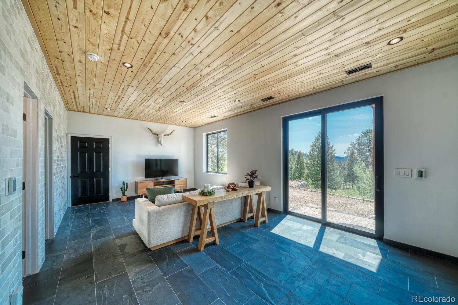 50 Ridge Lane Bailey, CO 80421 - Photo 23 of 37 a living room with furniture and wooden floor