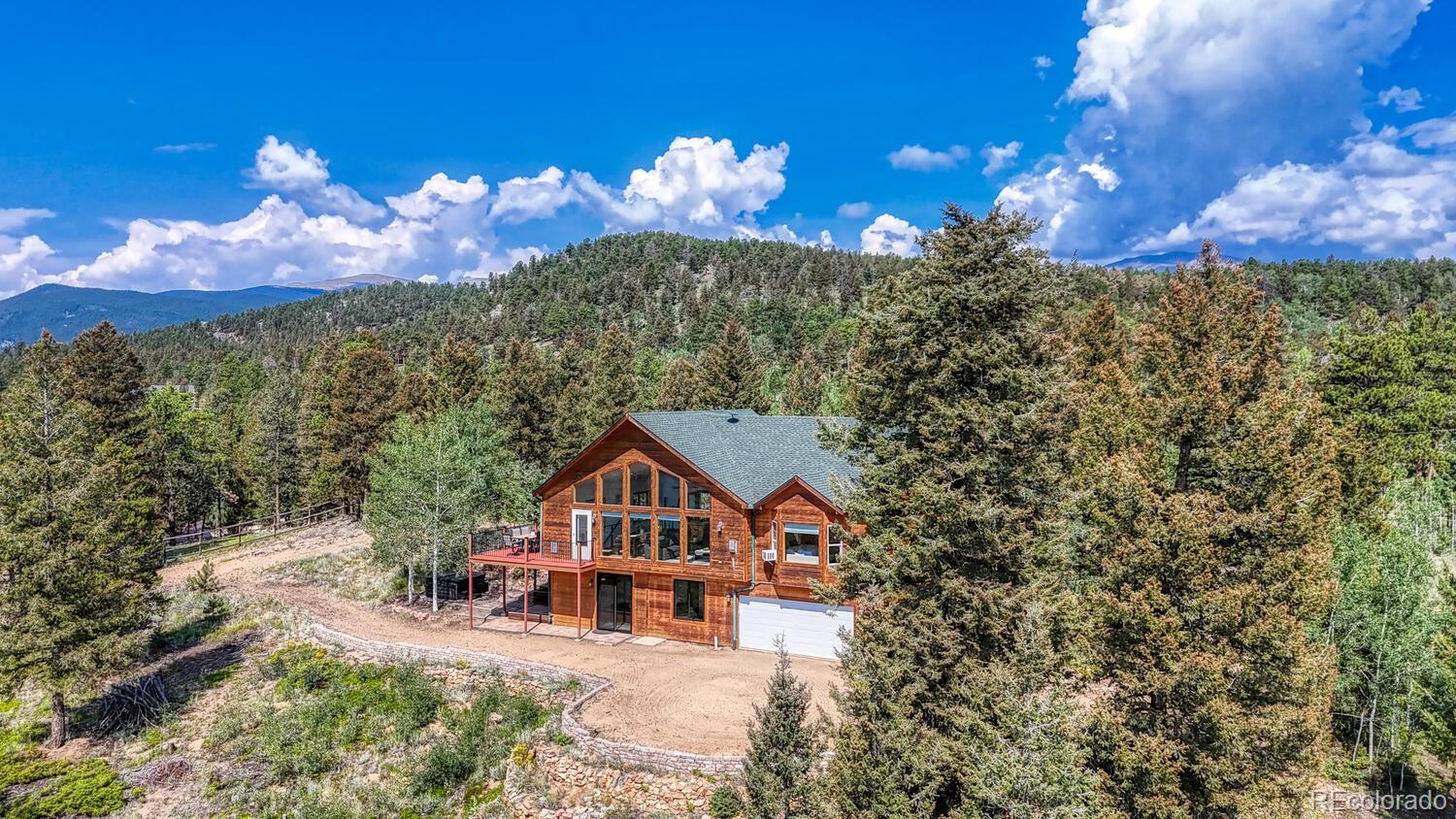 50 Ridge Lane Bailey, CO 80421 - Photo 25 of 37 a view of a house with a yard