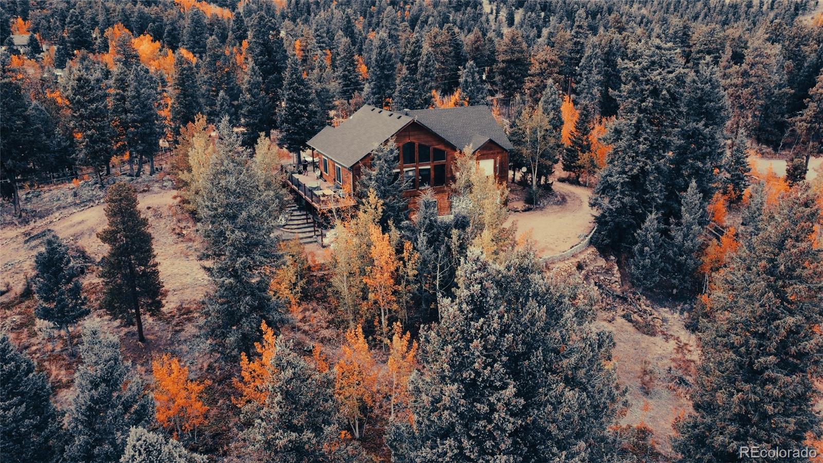 50 Ridge Lane Bailey, CO 80421 - Photo 32 of 37 a aerial view of house with yard and trees all around