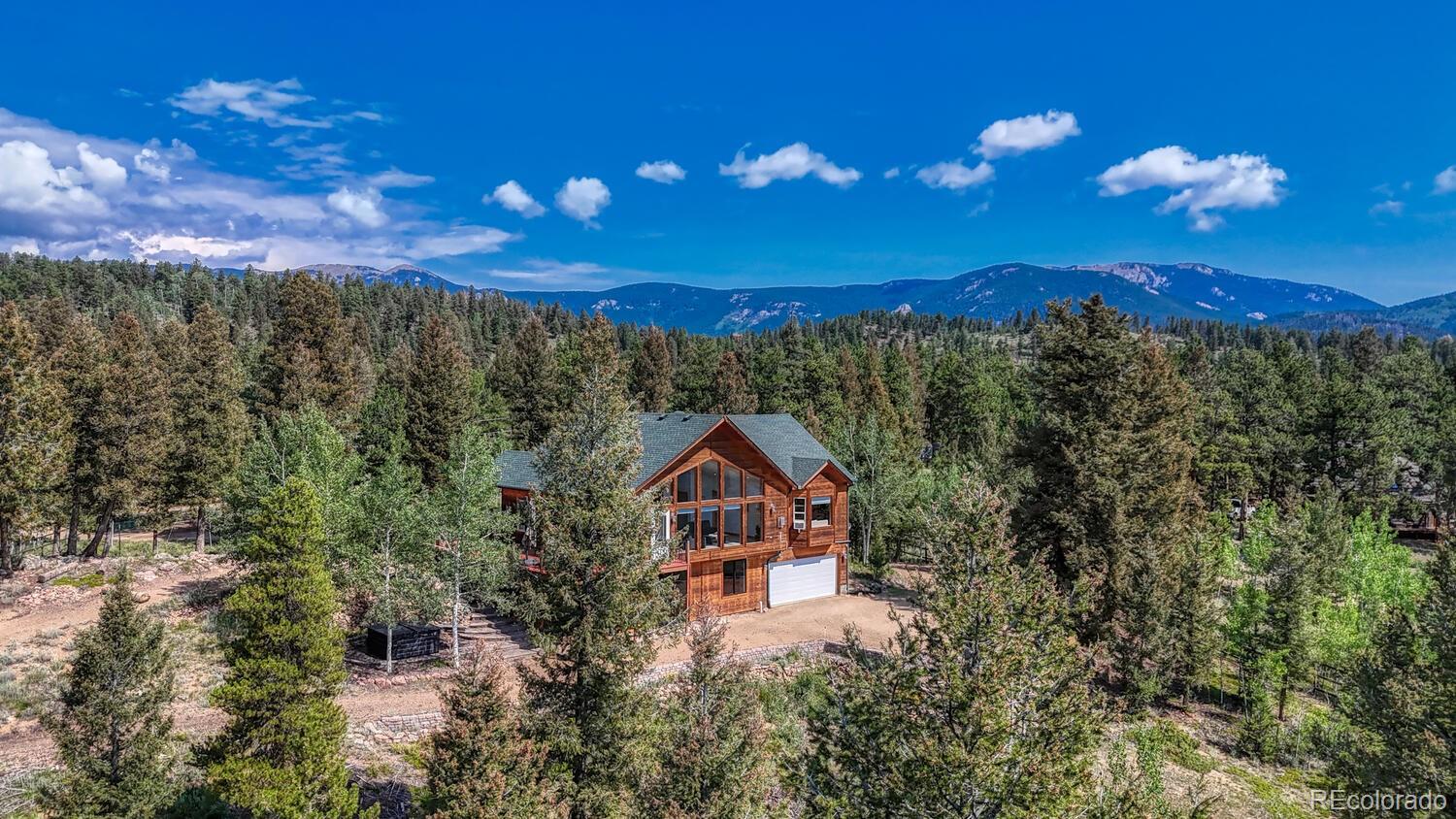 50 Ridge Lane Bailey, CO 80421 - Photo 34 of 37 a view of a house with a yard