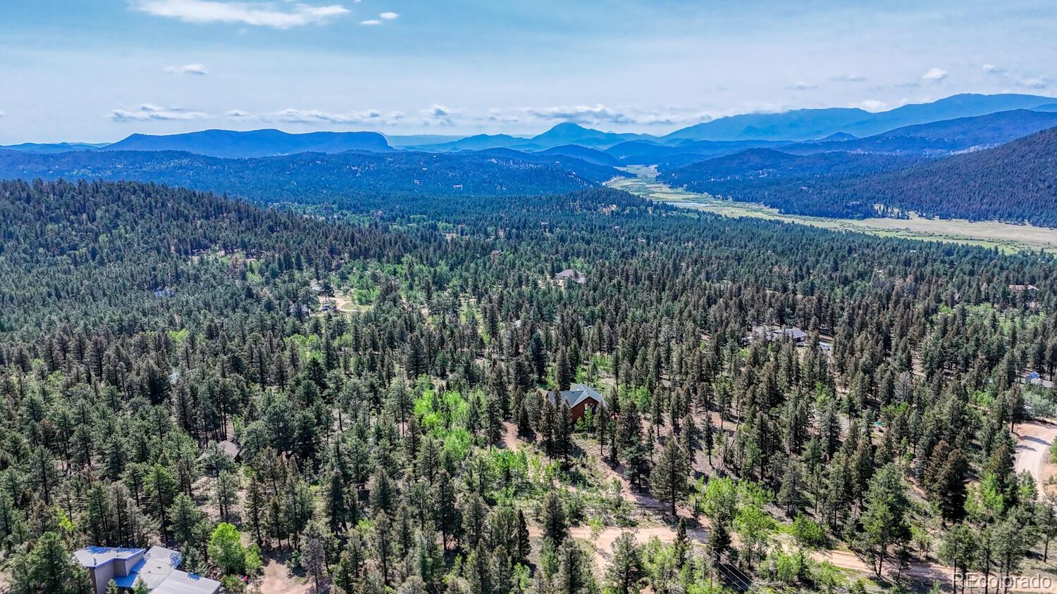 50 Ridge Lane Bailey, CO 80421 - Photo 36 of 37 a view of a lush green hillside and a mountain