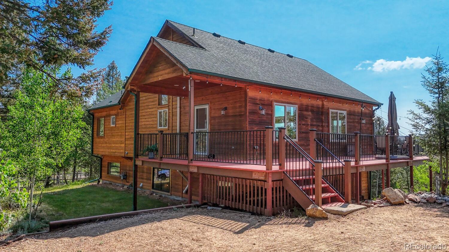 50 Ridge Lane Bailey, CO 80421 - Photo 4 of 37 a view of a house with a yard