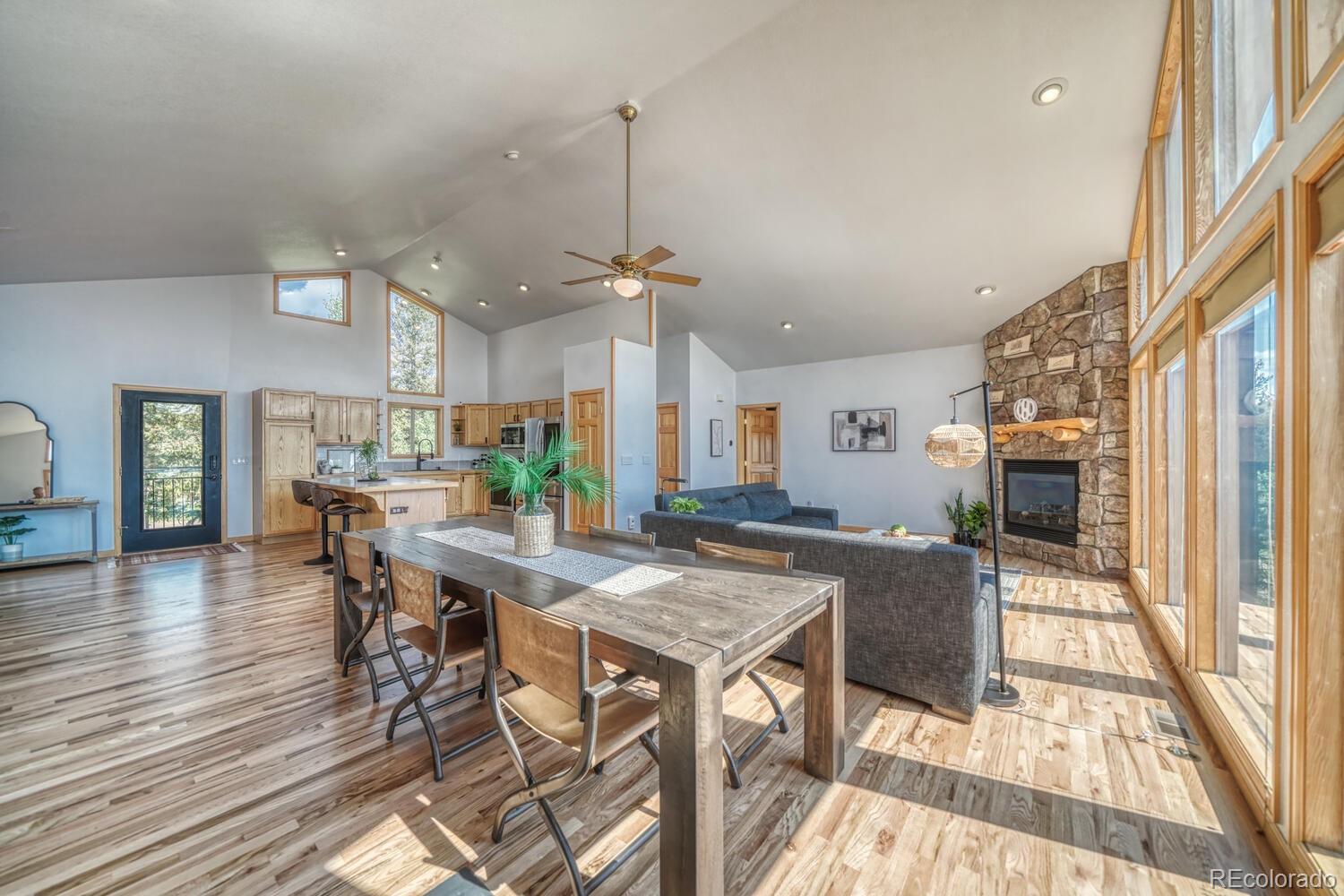 50 Ridge Lane Bailey, CO 80421 - Photo 10 of 37 a view of a dining room with furniture window and wooden floor