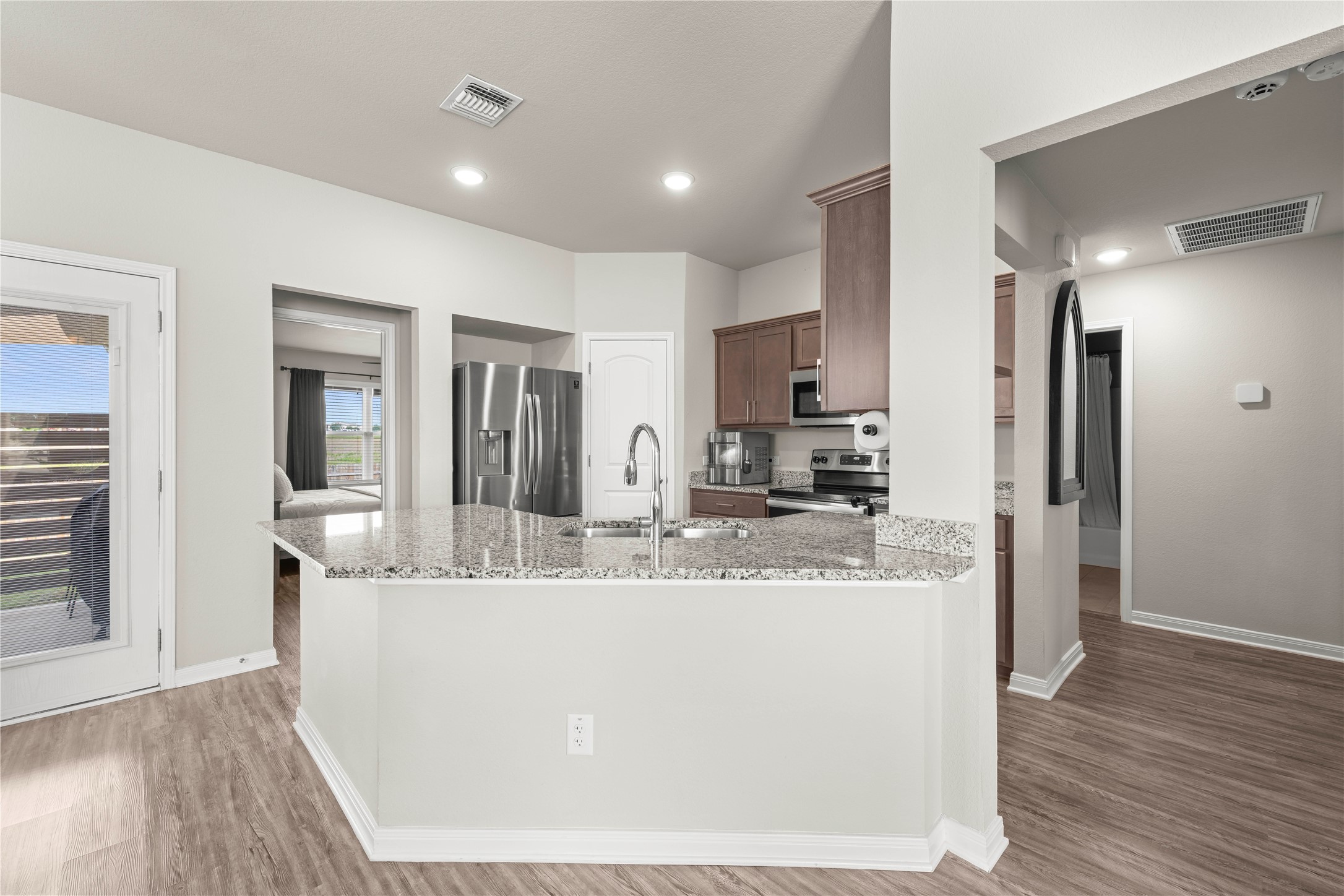 3018 Clevelander Drive Temple, TX 76504 - Photo 17 of 21 a large kitchen with granite countertop a large counter top and stainless steel appliances