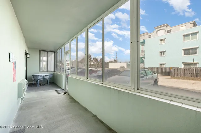 a view of a car parked in front of a building