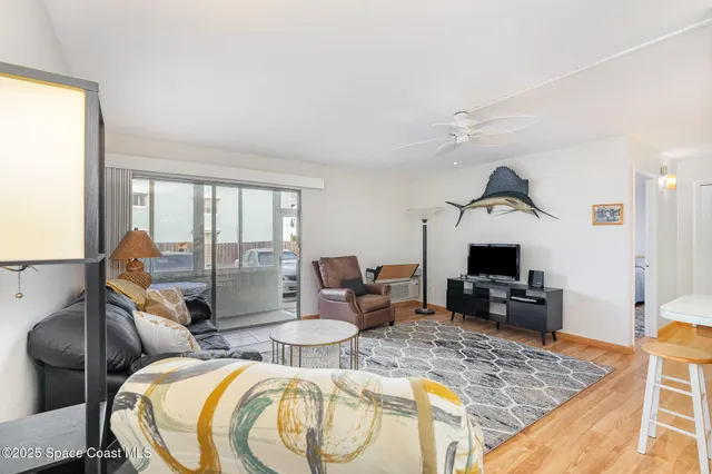 a living room with fireplace furniture and a flat screen tv