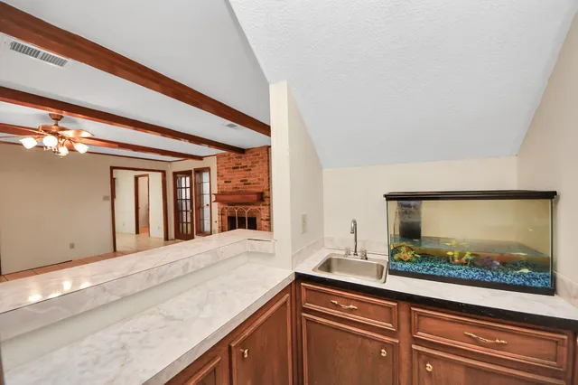 a view of a livingroom with a staircase and fireplace