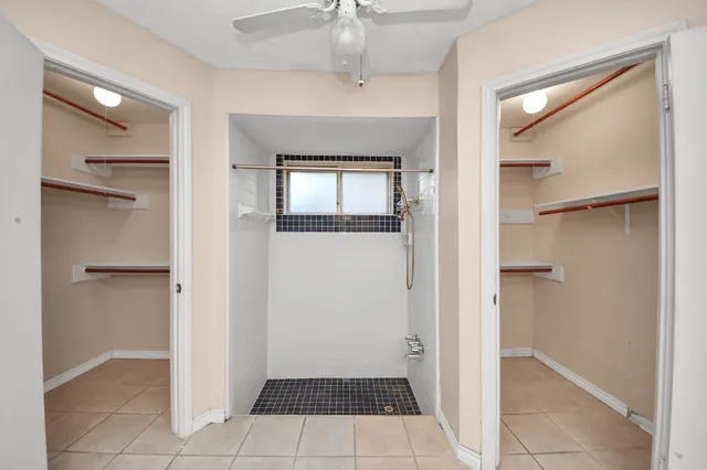 a bathroom with a sink double vanity and a mirror