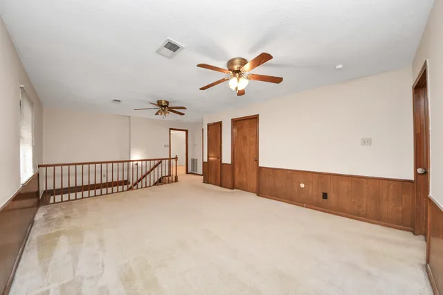 a view of a hallway with staircase