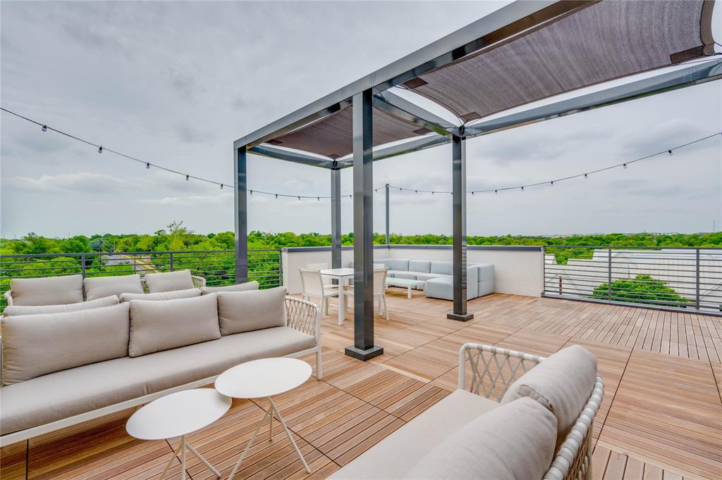 4801 Springdale Road, Unit 1307 Austin, TX 78723 - Photo 20 of 30 a balcony with furniture and a wooden floor