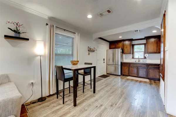 a view of kitchen with furniture and wooden floor