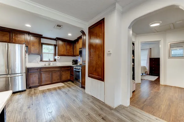a kitchen with a refrigerator and a sink