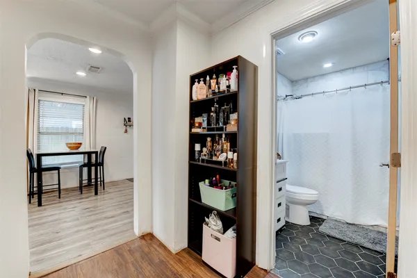 a bathroom with a toilet and a shower