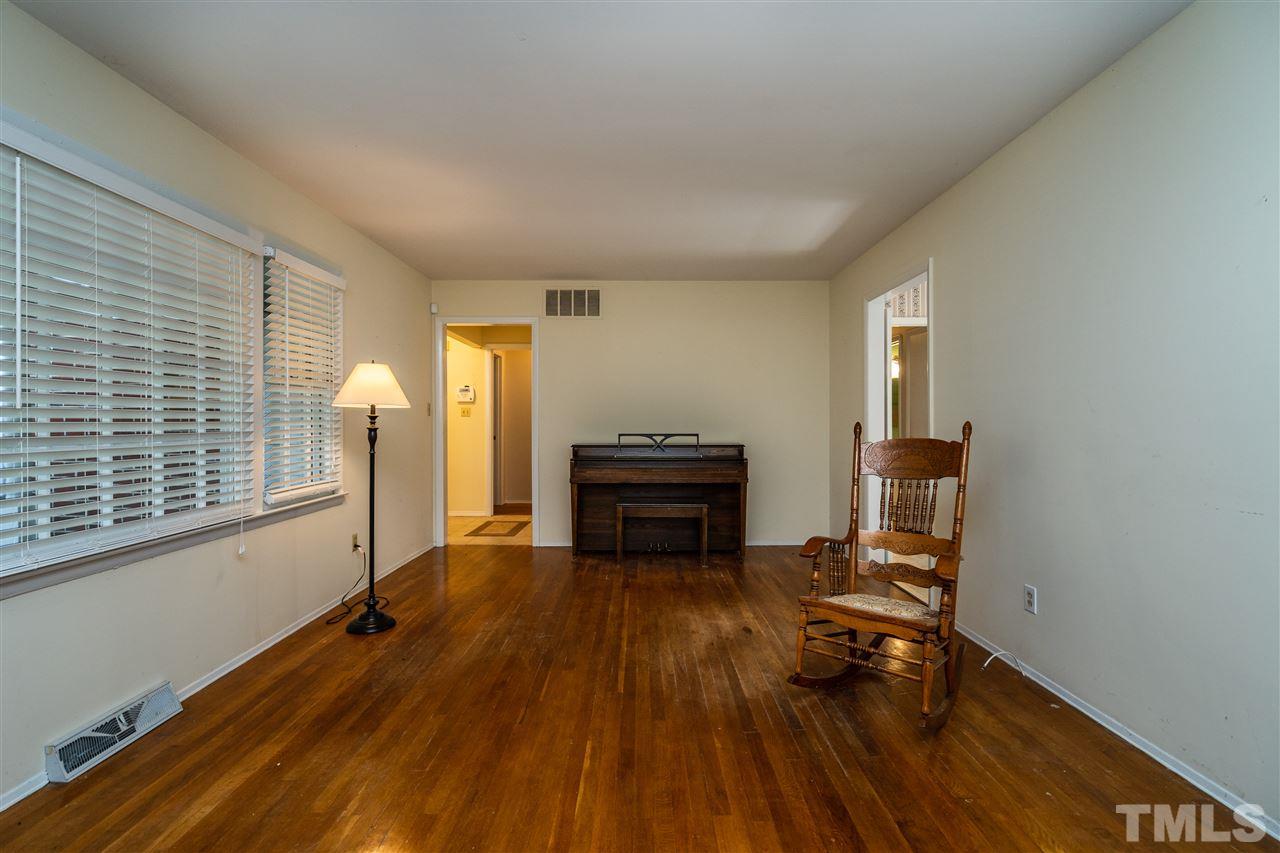 4708 Latimer Road Raleigh, NC 27609 - Photo 3 of 22 a living room with furniture and a wooden floor