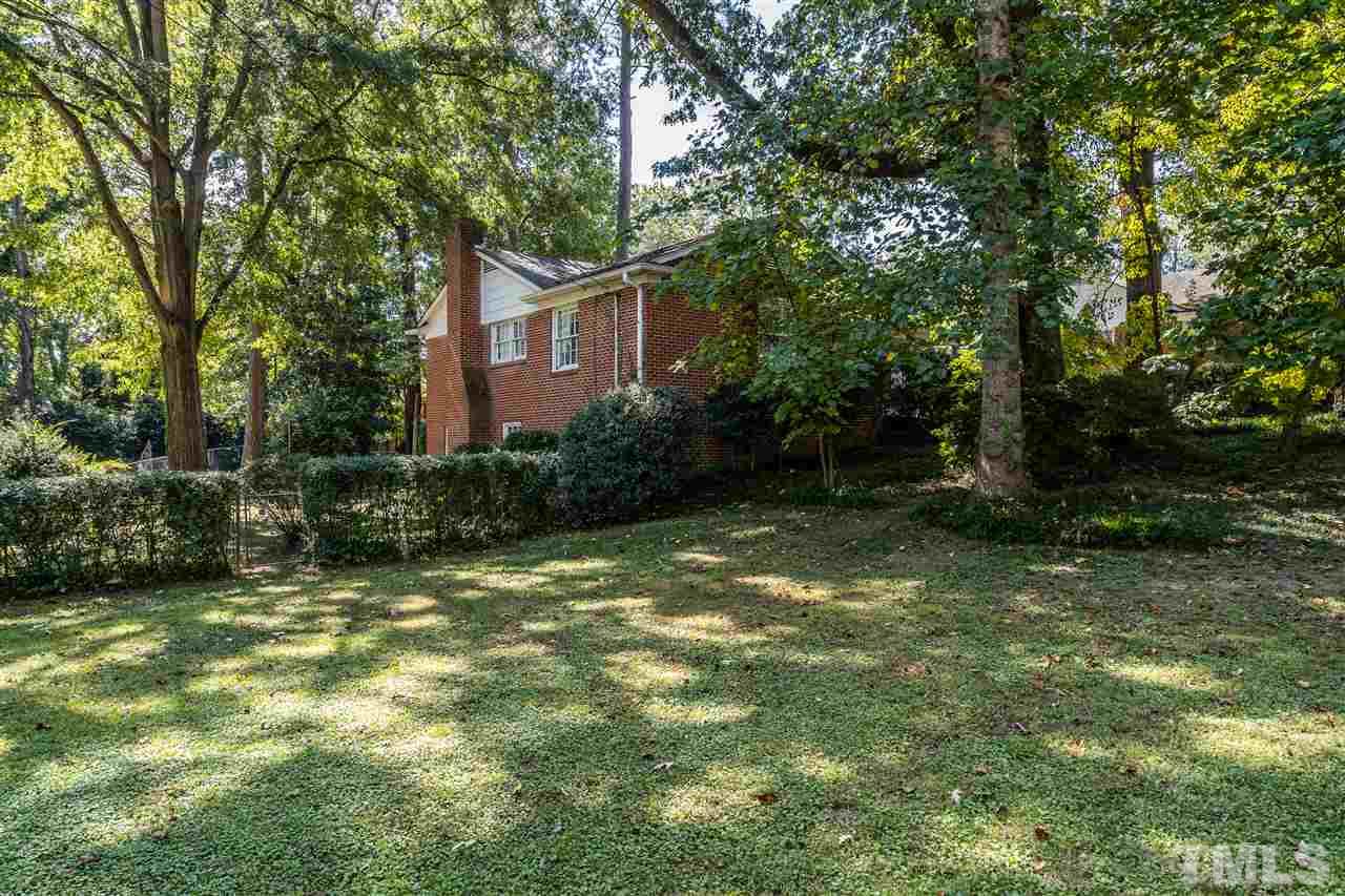 4708 Latimer Road Raleigh, NC 27609 - Photo 22 of 22 a backyard of a house with lots of green space