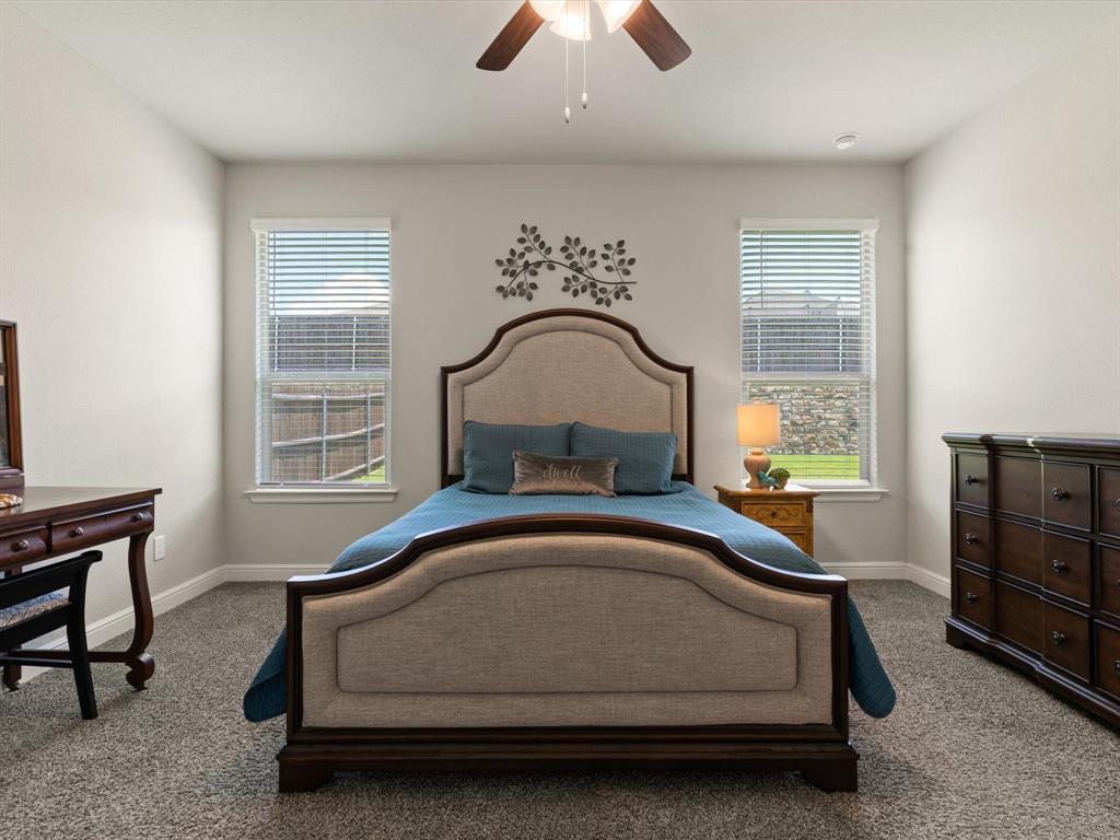 270 Lunayena Road Rhome, TX 76078 - Photo 27 of 37 The spacious primary bedroom offers a comfortable retreat with ample natural light and a well-proportioned layout, providing a private space to unwind at the end of the day.