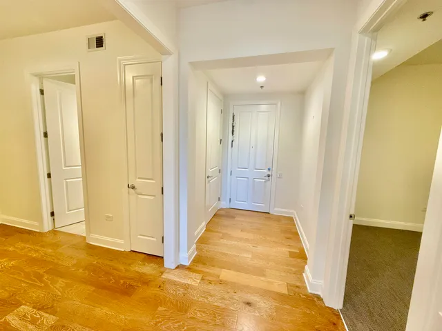 a view of a room with a ceiling fan