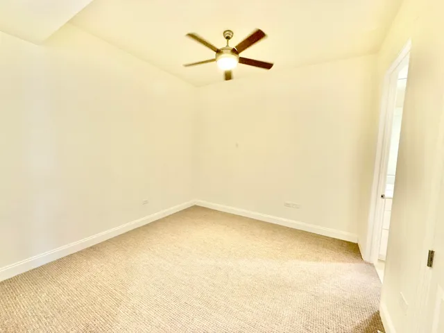 a bathroom with a double vanity sink toilet mirror and shower