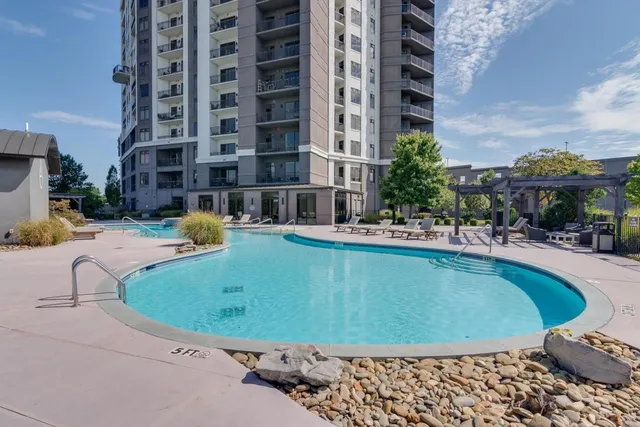 a view of a patio with couches and potted plants