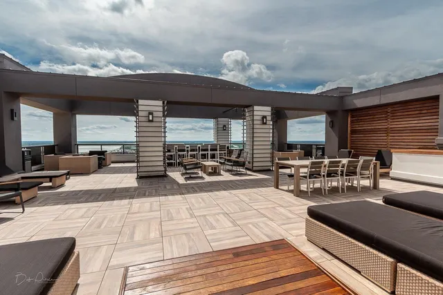 a outdoor space with a large window and furniture