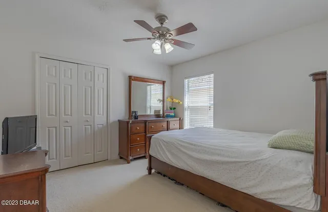 a bedroom with a bed and window