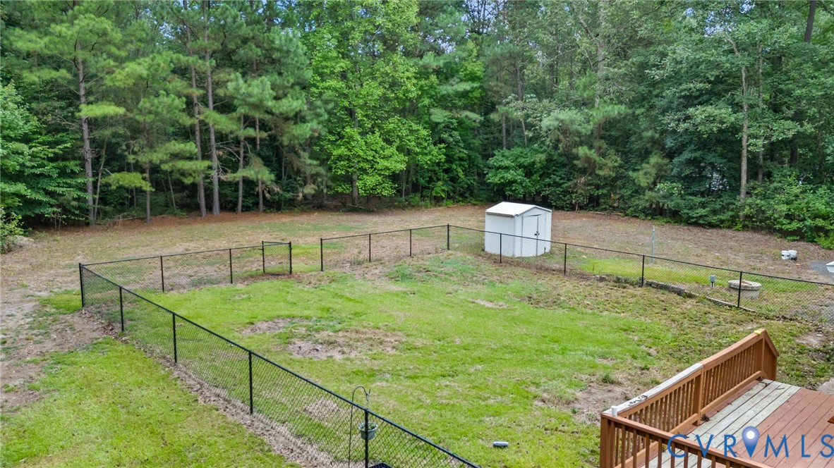 2869 Newville Road Disputanta, VA 23842 - Photo 26 of 26 Expansive backyard featuring a partial chain-link