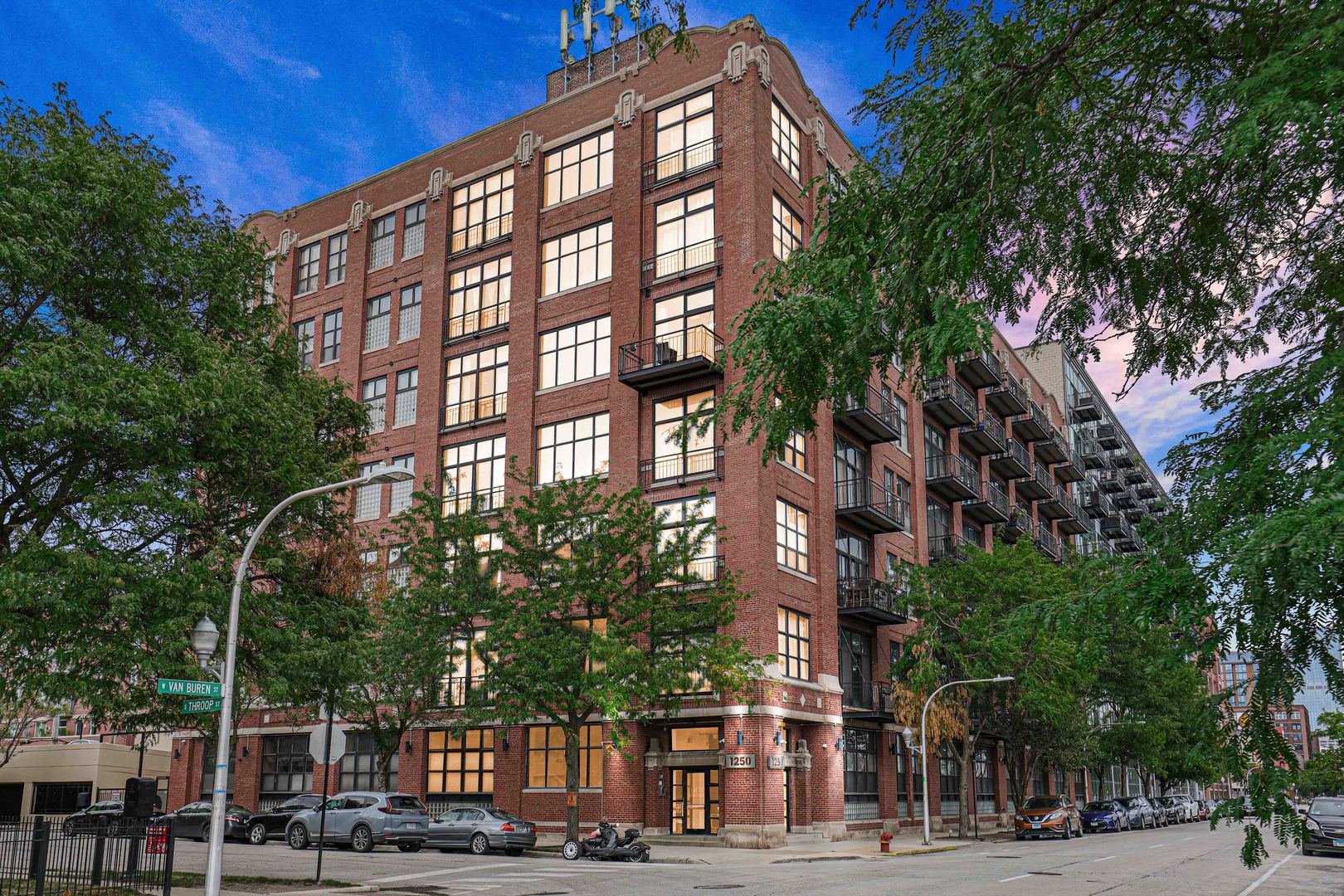 1250 West Van Buren Street, Unit 515 Chicago, IL 60607 - Photo 1 of 17 a view of a building and a street view