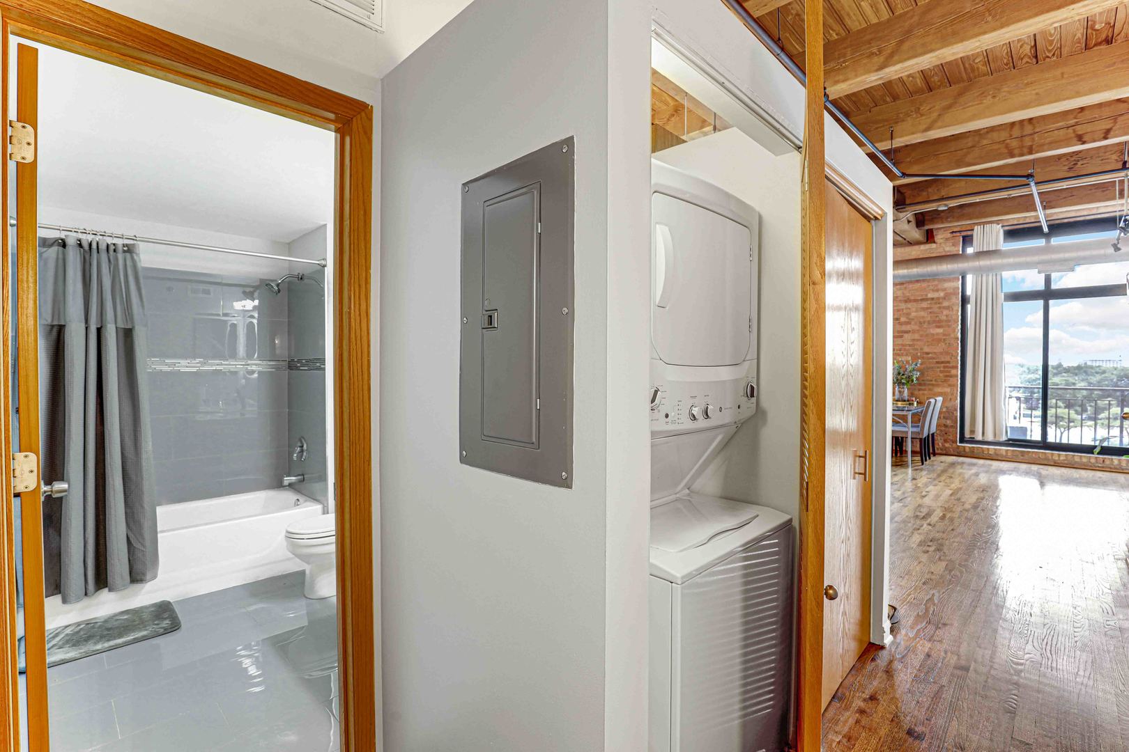 1250 West Van Buren Street, Unit 515 Chicago, IL 60607 - Photo 11 of 17 a bathroom with a glass shower door and mirror