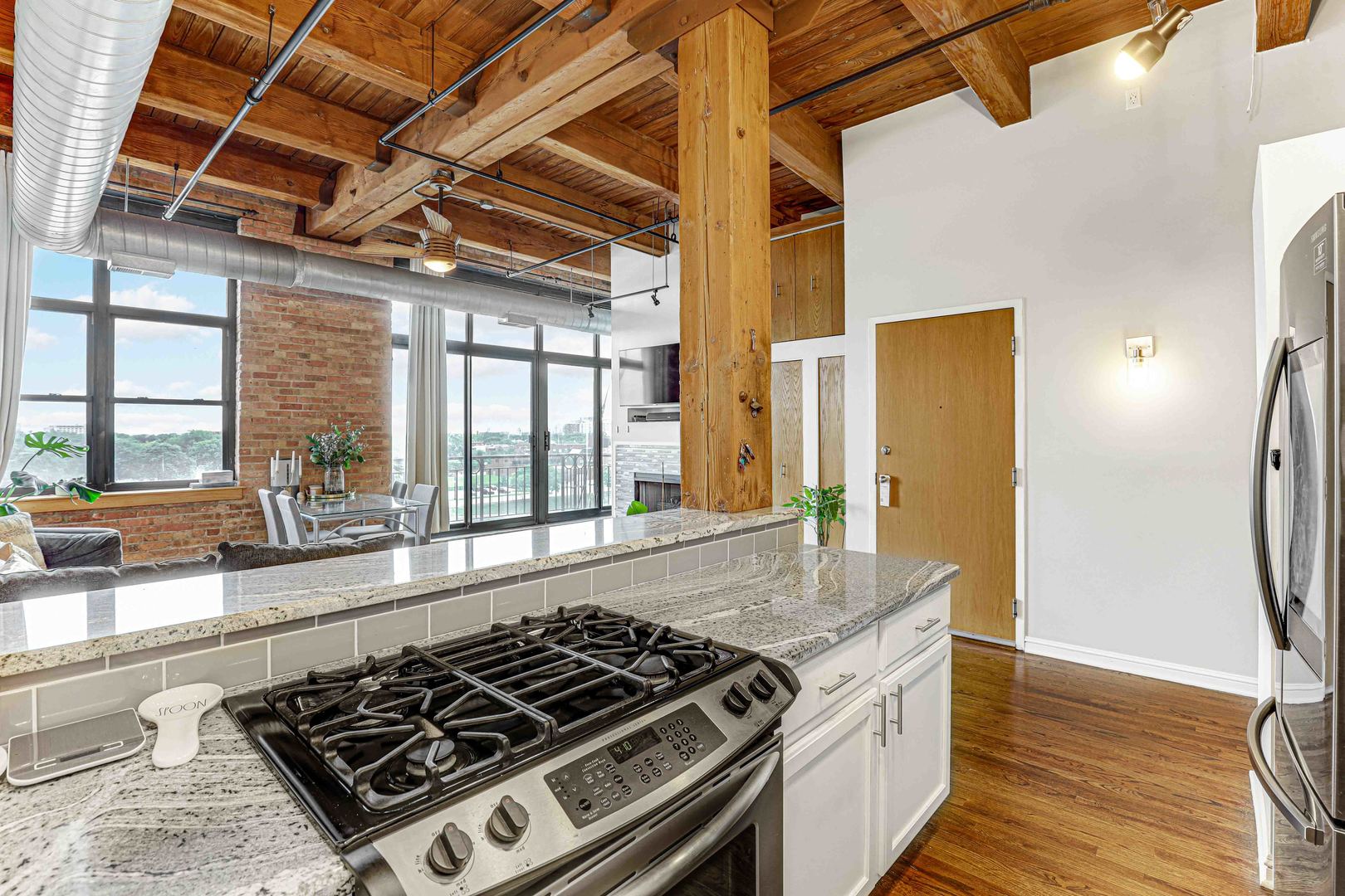 1250 West Van Buren Street, Unit 515 Chicago, IL 60607 - Photo 4 of 17 a kitchen with a stove and a refrigerator