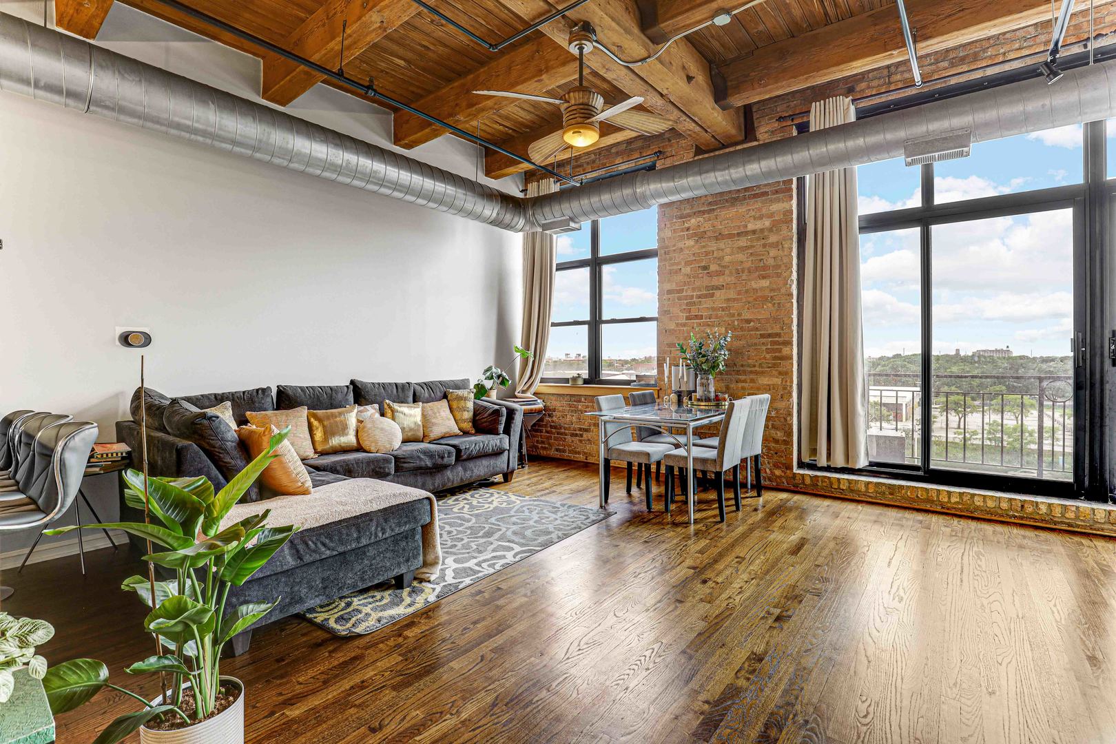 1250 West Van Buren Street, Unit 515 Chicago, IL 60607 - Photo 6 of 17 a living room with furniture and a large window