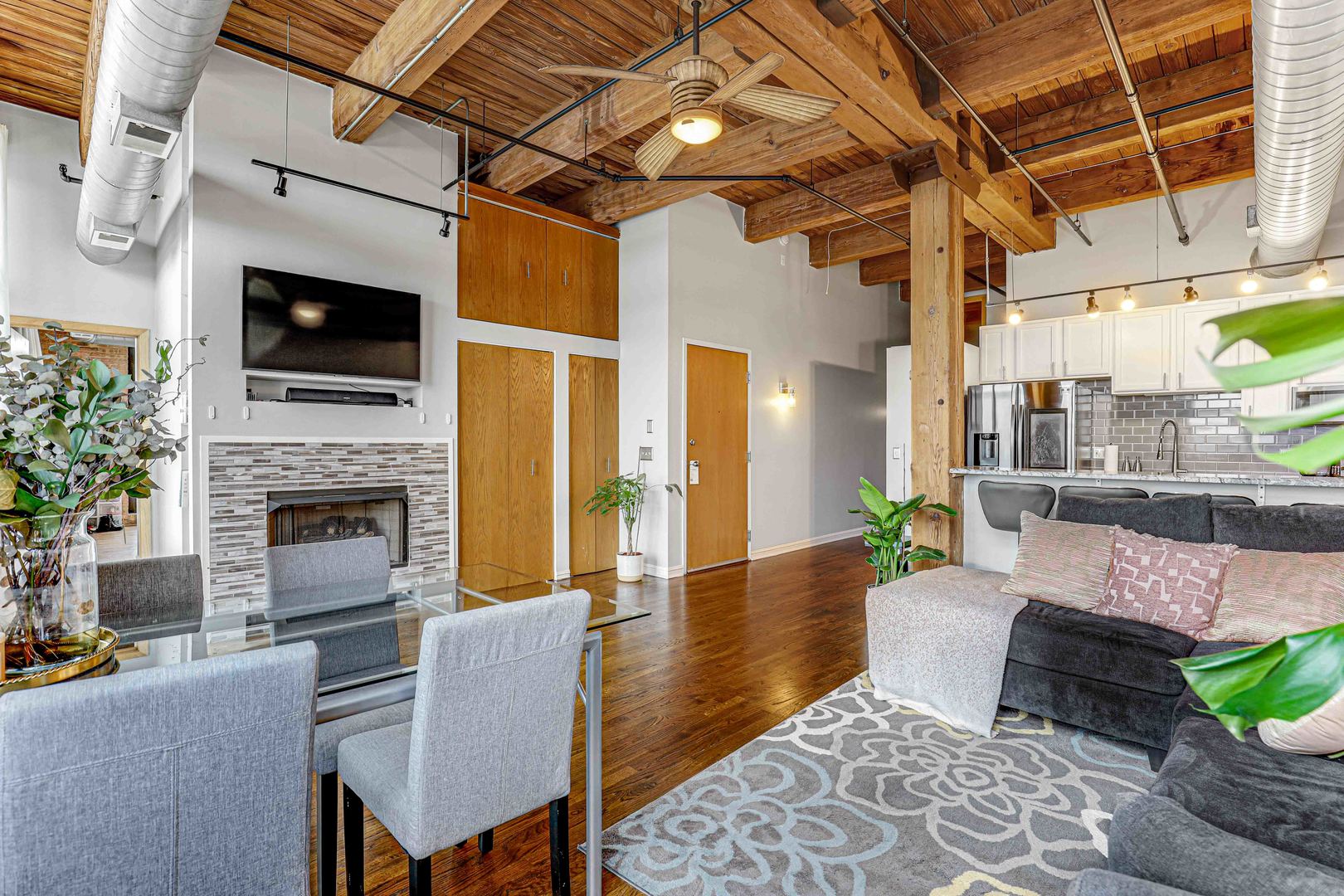 1250 West Van Buren Street, Unit 515 Chicago, IL 60607 - Photo 8 of 17 a lobby with furniture and a fireplace